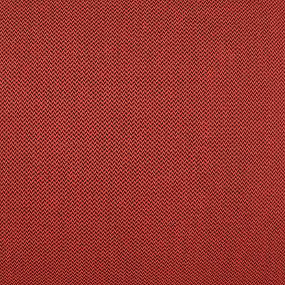 Close-up red fabric with fine black chevron/herringbone knit pattern; soft, durable textile for apparel.