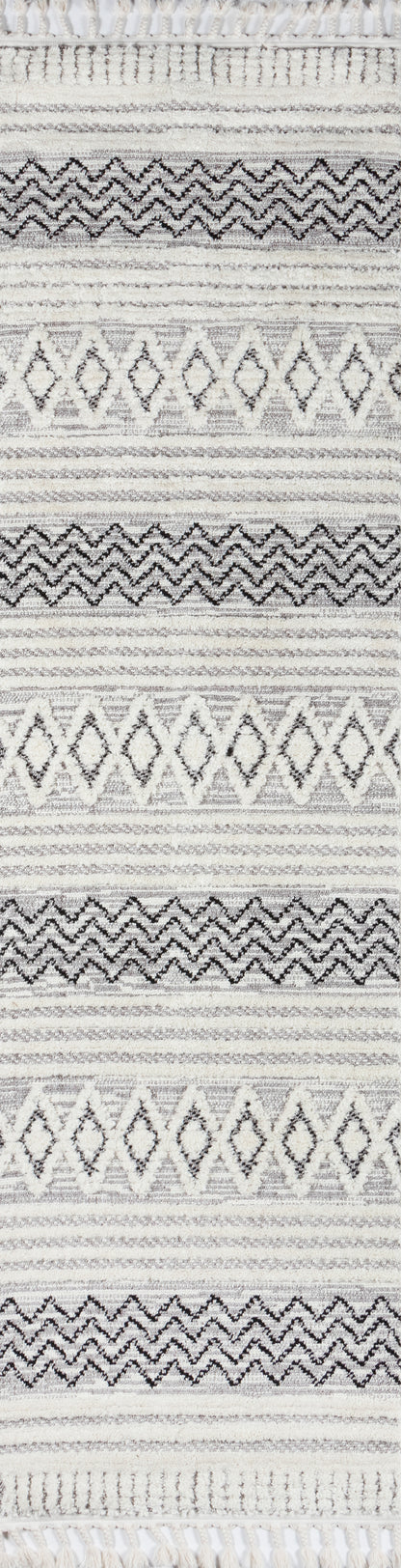Gray and ivory striped rug with diamond motifs and zigzag bands, woven texture, fringed ends.