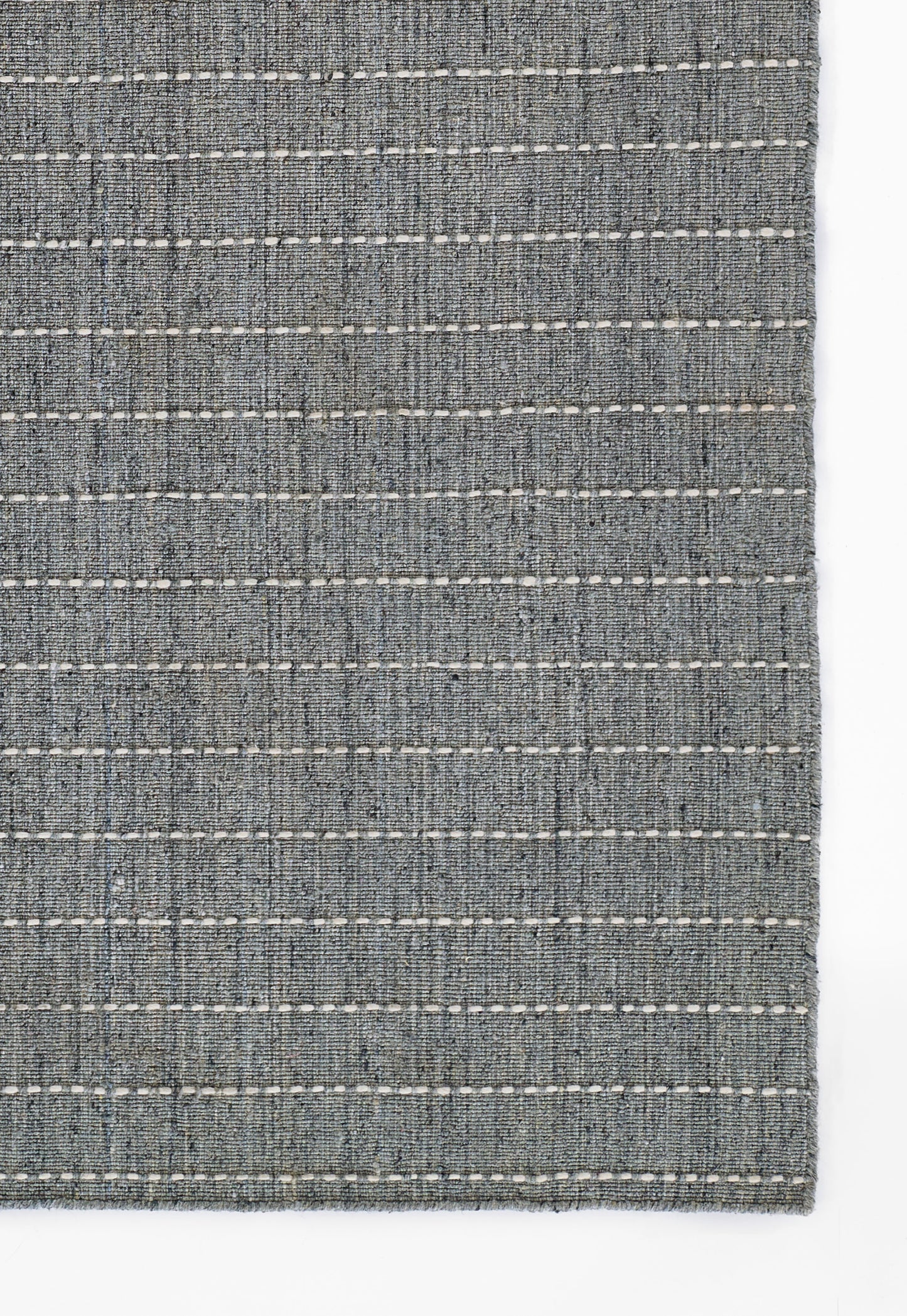 Blue-gray woven rug with white stitched horizontal stripes and textured fabric.