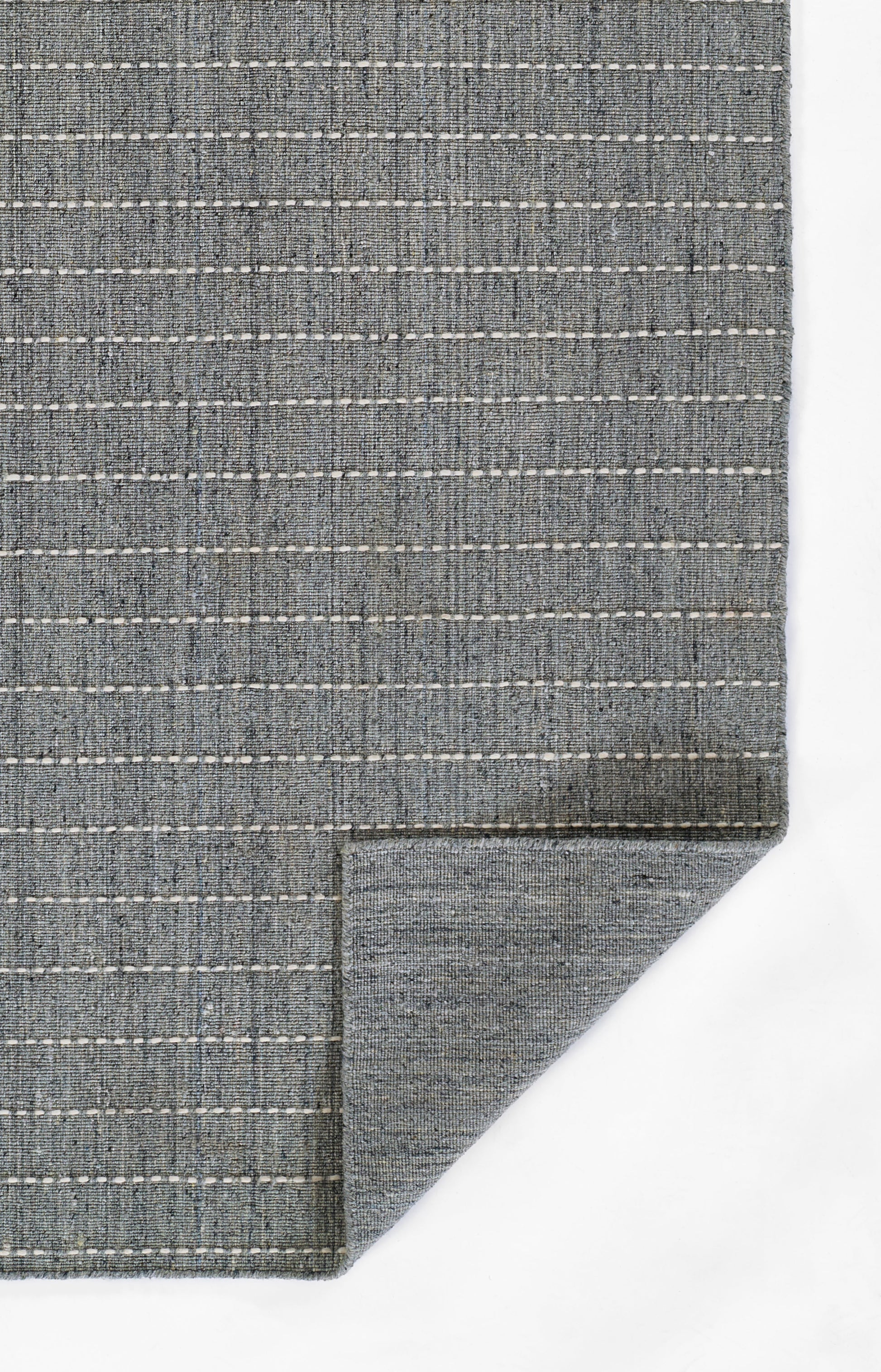 Blue-gray woven rug with white dashed stripes, flat-weave texture, rectangular.