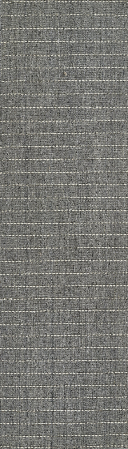 Blue-gray woven rug with thin white dashed stripes and textured weave.