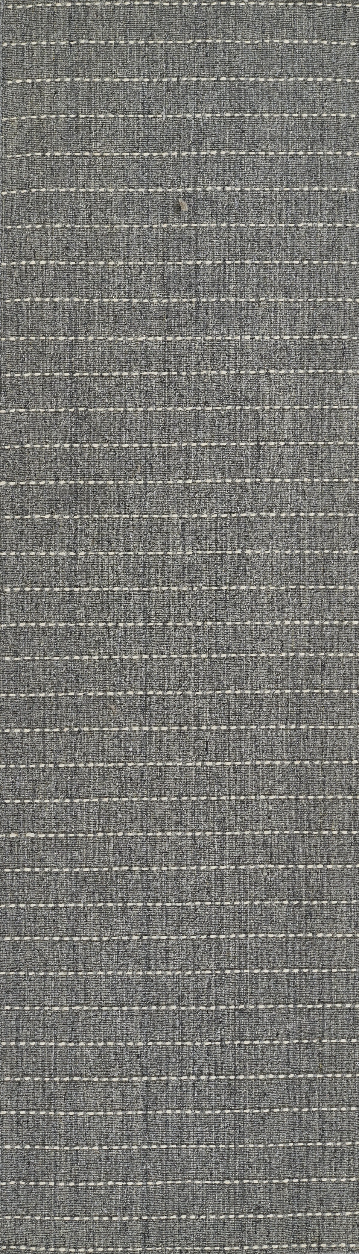 Blue-gray woven rug with white dashed horizontal stripes.