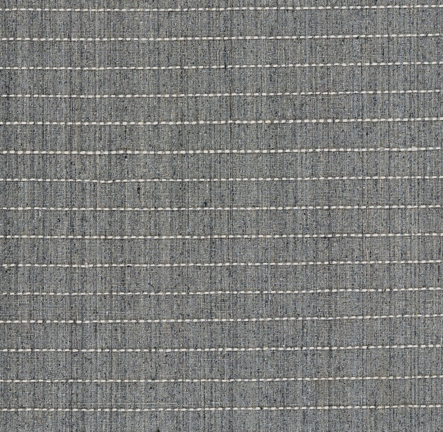 Blue-gray striped rug with a woven texture and thin white dashed lines.
