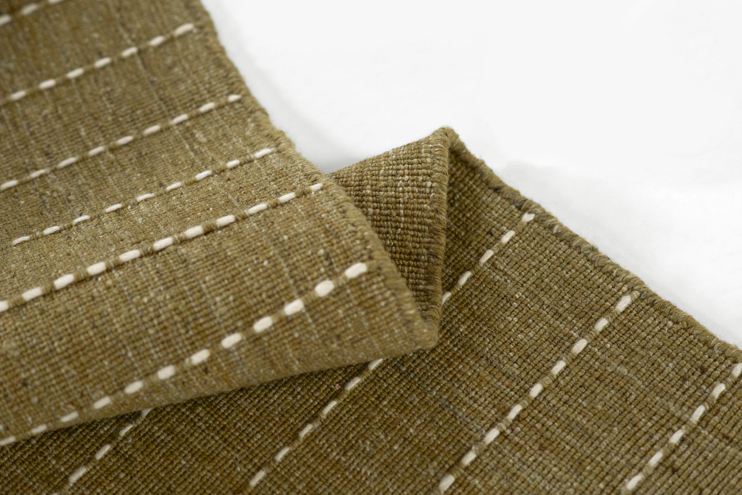 Olive green rug with woven texture and subtle grid pattern; 8' x 10'.