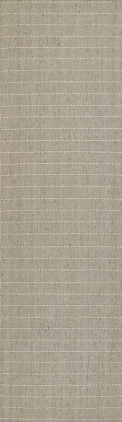 Natural beige woven rug with subtle pale stripes and textured fiber weave.