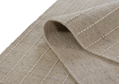 Olive natural-toned rug with textured weave, 3'6" x 5'6