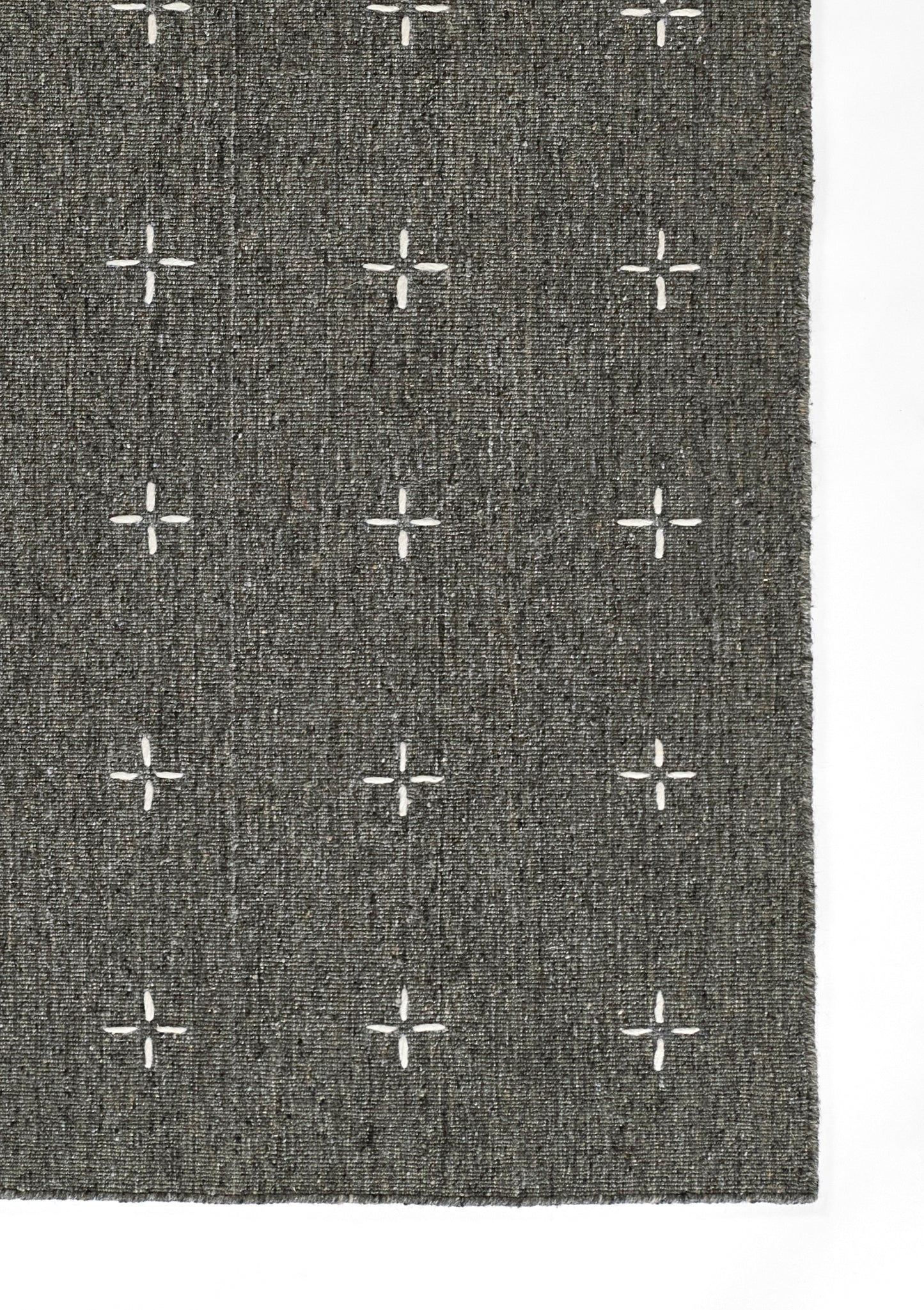 Rectangular charcoal gray woven rug with white cross motifs in a grid; modern geometric style, for living room or hallway.