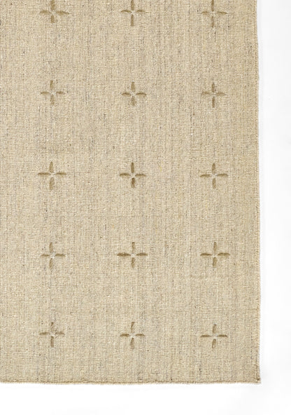 Beige woven rug with plus-shaped raised motifs and textured surface for a neutral, minimalist look.