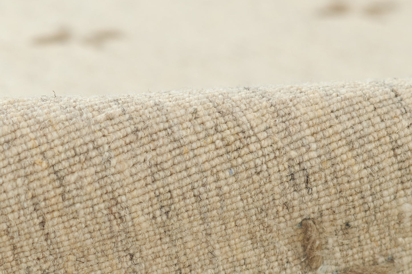 Natural beige woven rug runner close-up; chunky loop texture with subtle flecks for rustic decor.