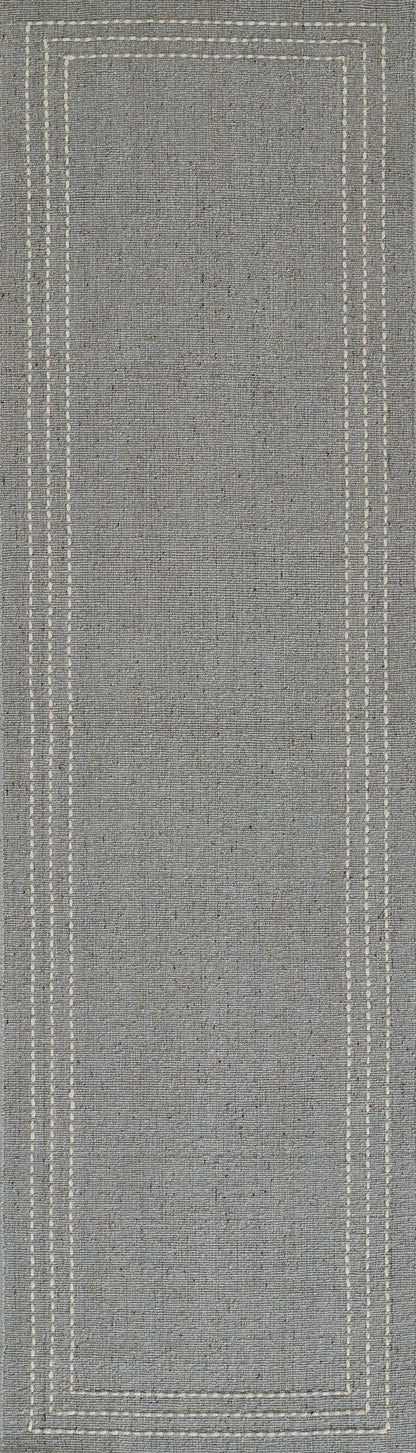 Gray woven rug runner with white stitch-border detailing; rectangular, minimalist home decor.