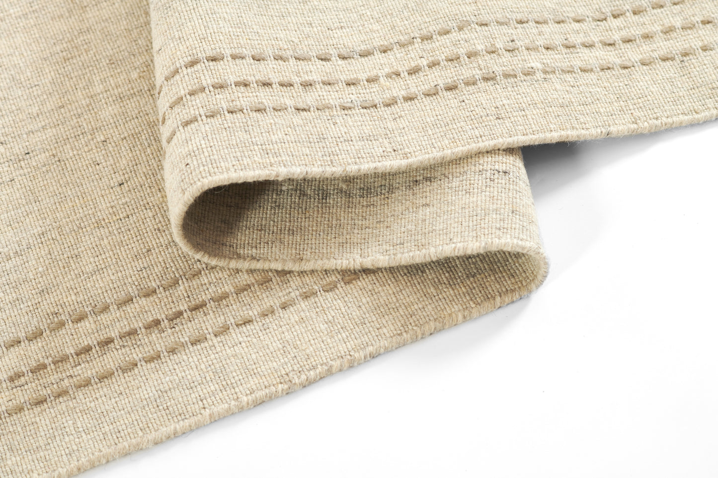 Beige natural woven fabric with stitched border and rolled edge; rustic linen/jute look.