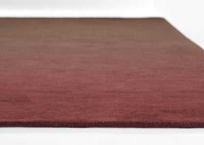 Ombre burgundy rug with subtle gradient, low-pile, rectangular, soft & cozy for living room or bedroom.