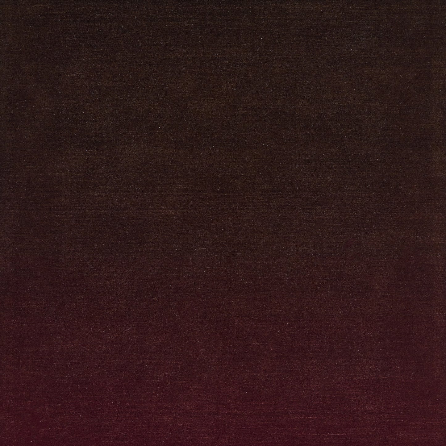 Ombre burgundy-to-black rug with soft pile, 9' x 12'.