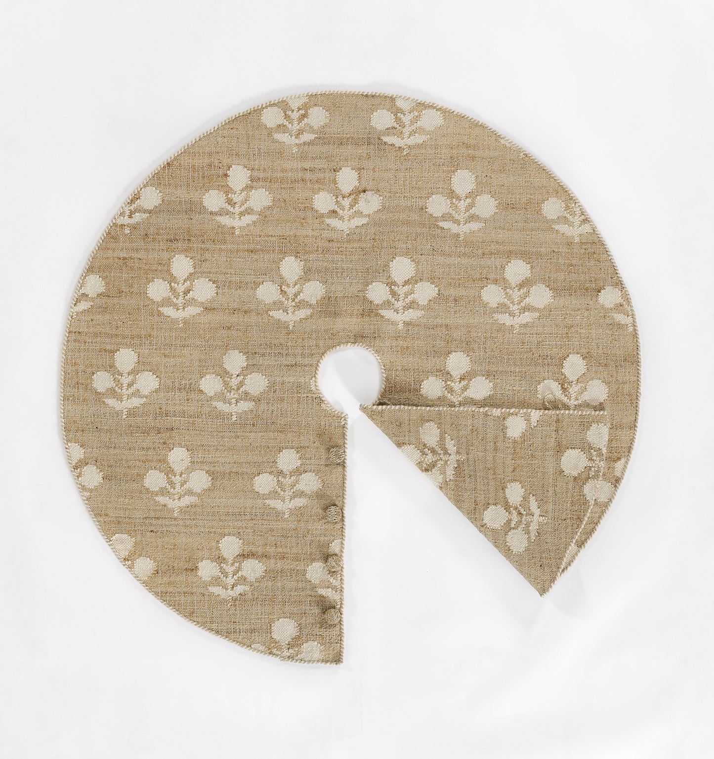 Natural beige round rug with white floral motifs; 5' diameter