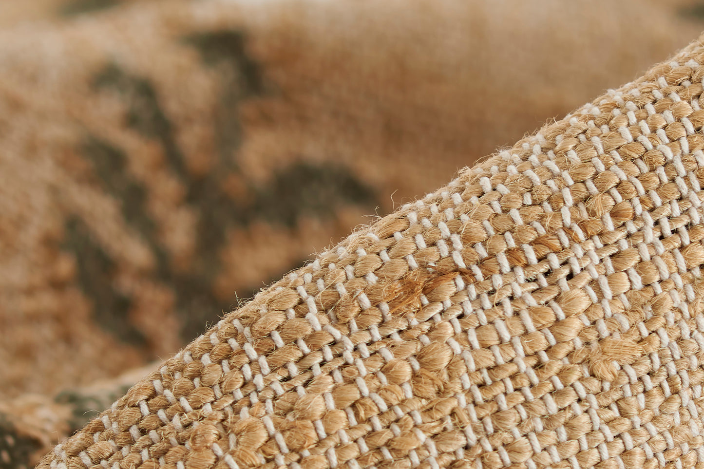 Natural beige raffia weave with chunky braided strands, rustic textured rug.