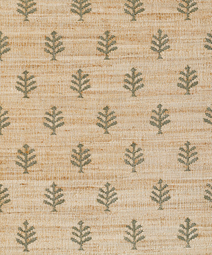 Natural beige jute rug with repeating green fern motifs; textured rustic weave.