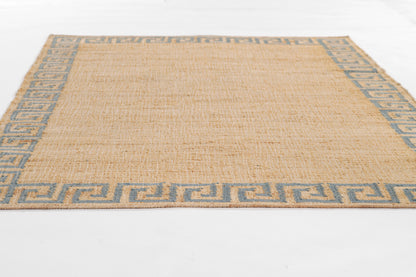 Natural beige jute rug with blue Greek key border, rectangular, rustic coastal style.