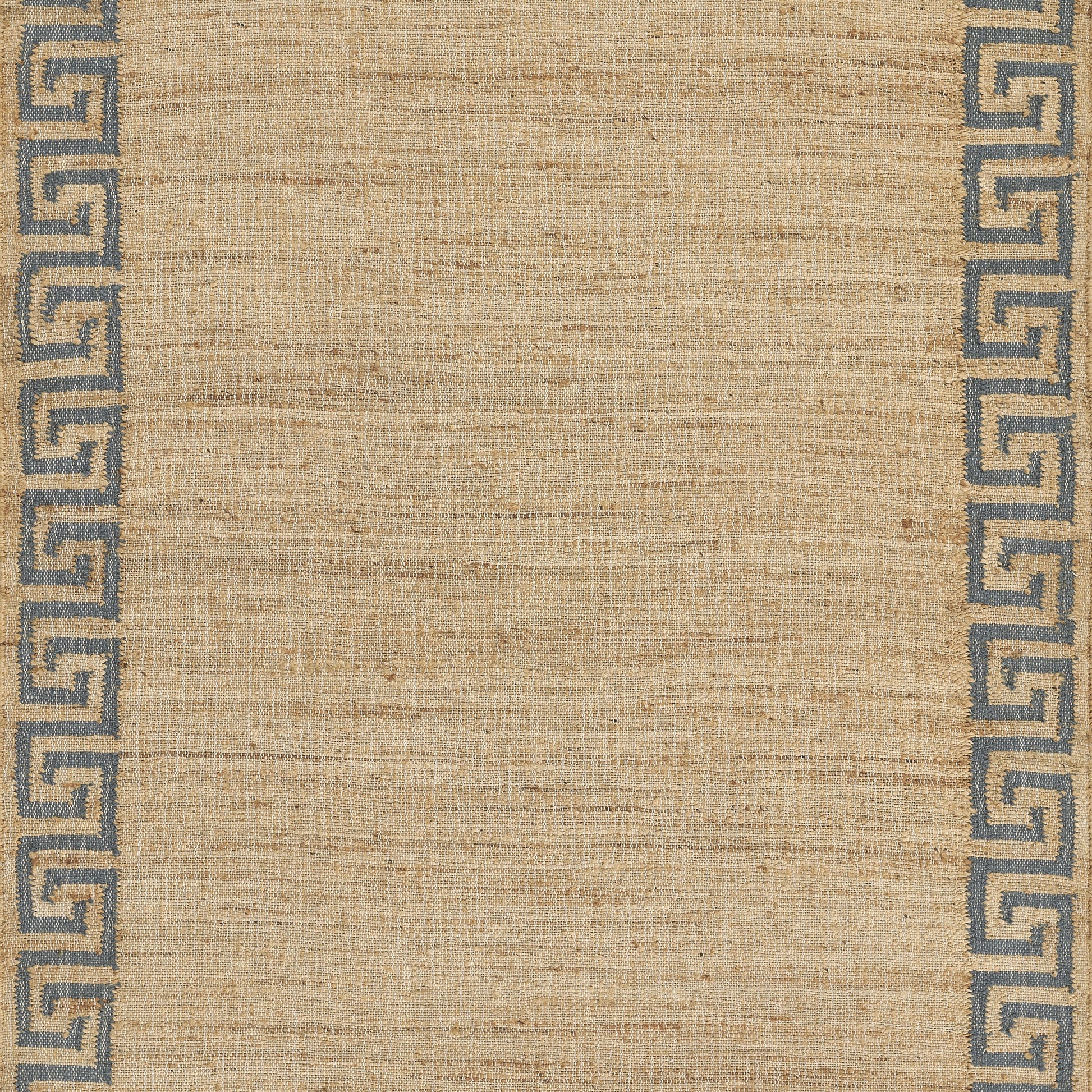 Beige woven rug with blue Greek key border along the edges, natural texture.