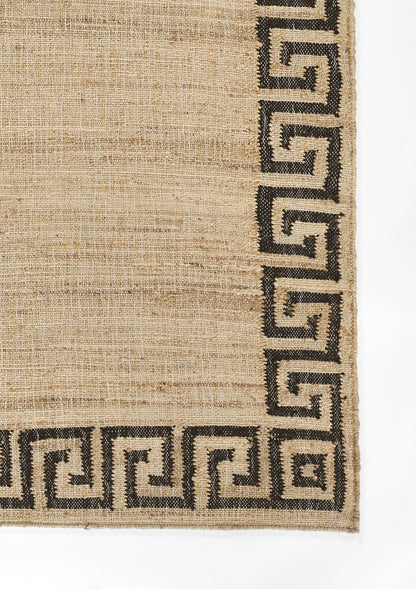 Natural beige jute rug with a black Greek-key border along the edges; textured woven surface.