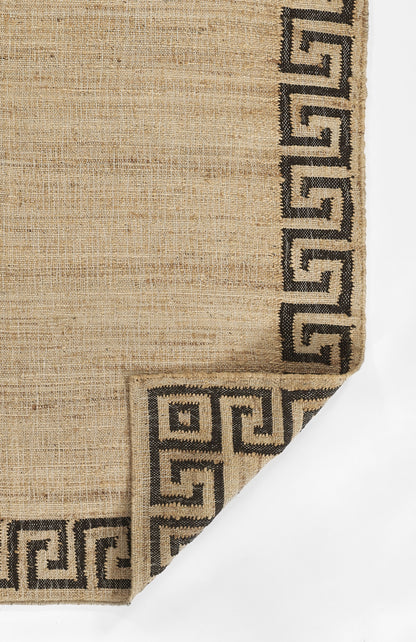Natural beige jute rug with black Greek-key border along edges; rectangular, textured weave.