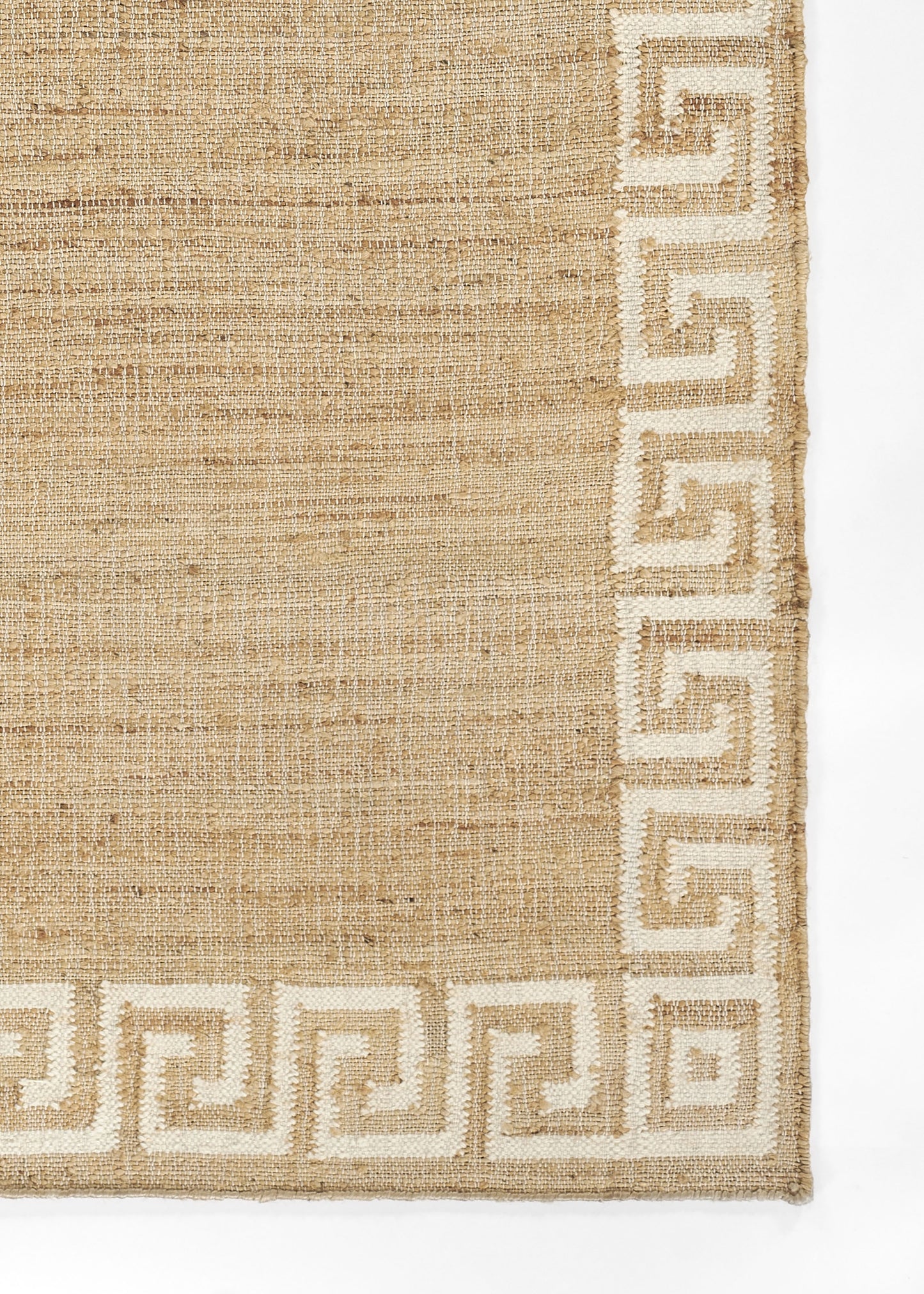 Natural beige jute rug with white Greek-key border along edges, rectangular woven texture.