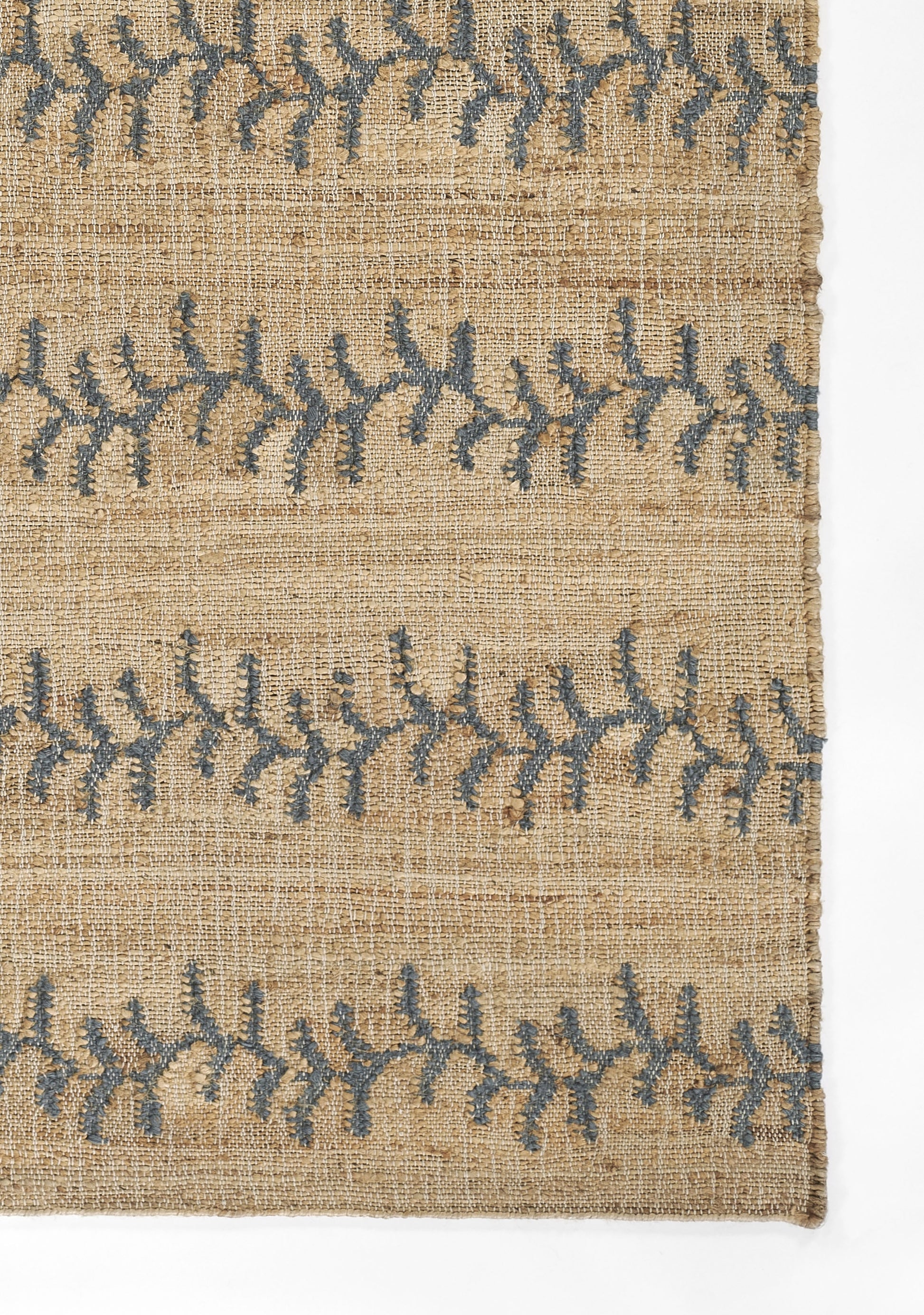 Beige jute rug with vine stripe pattern; natural woven texture, 10' x 14'.