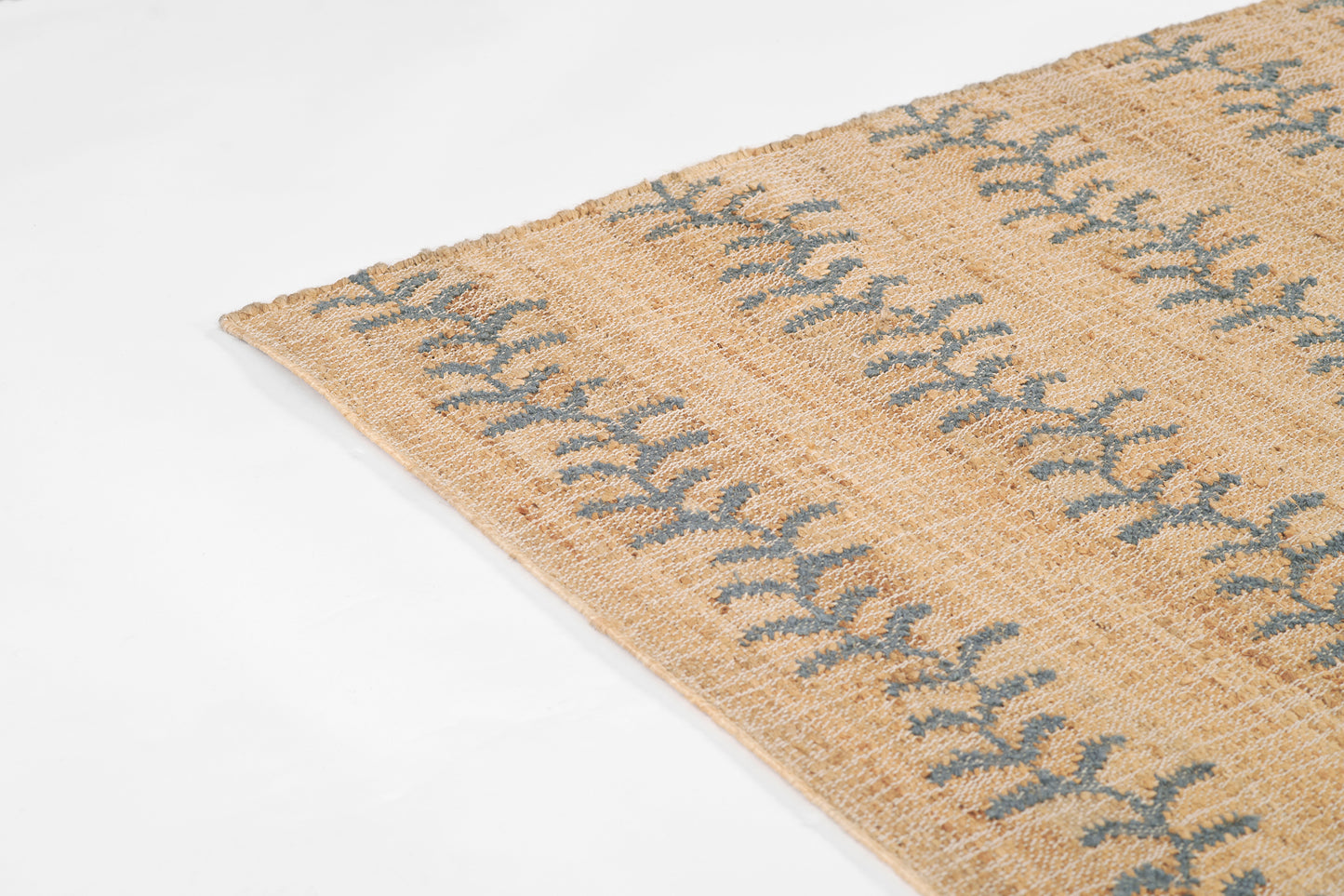 Beige woven jute runner with blue vine stripe pattern; rectangular, rustic coastal style; measures 2'3" x 8'.
