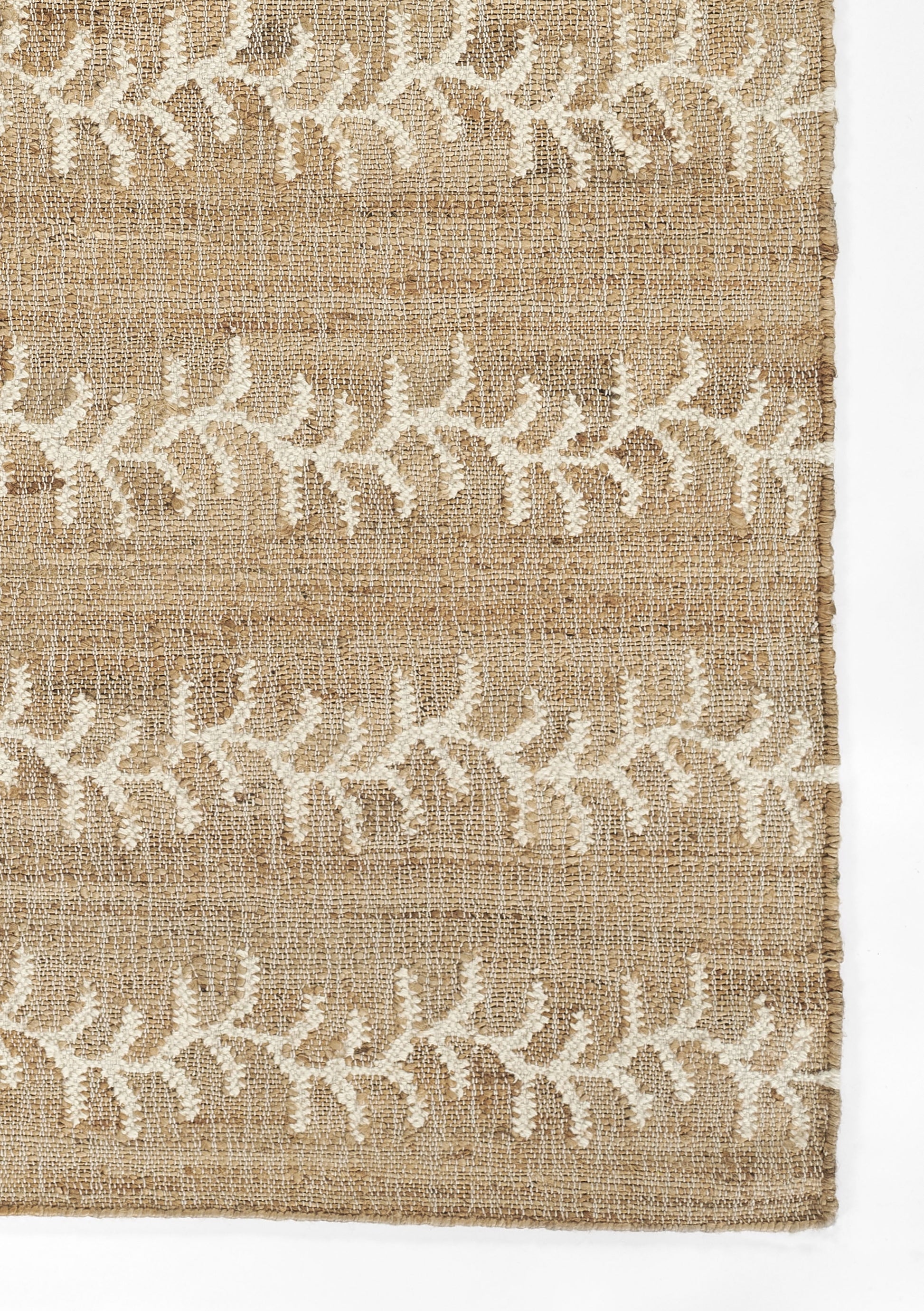 Beige jute textile with white embroidered leafy vine motif, rustic rug or runner.