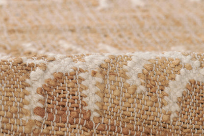 Beige & ivory handwoven jute rug with geometric pattern and chunky textured weave.