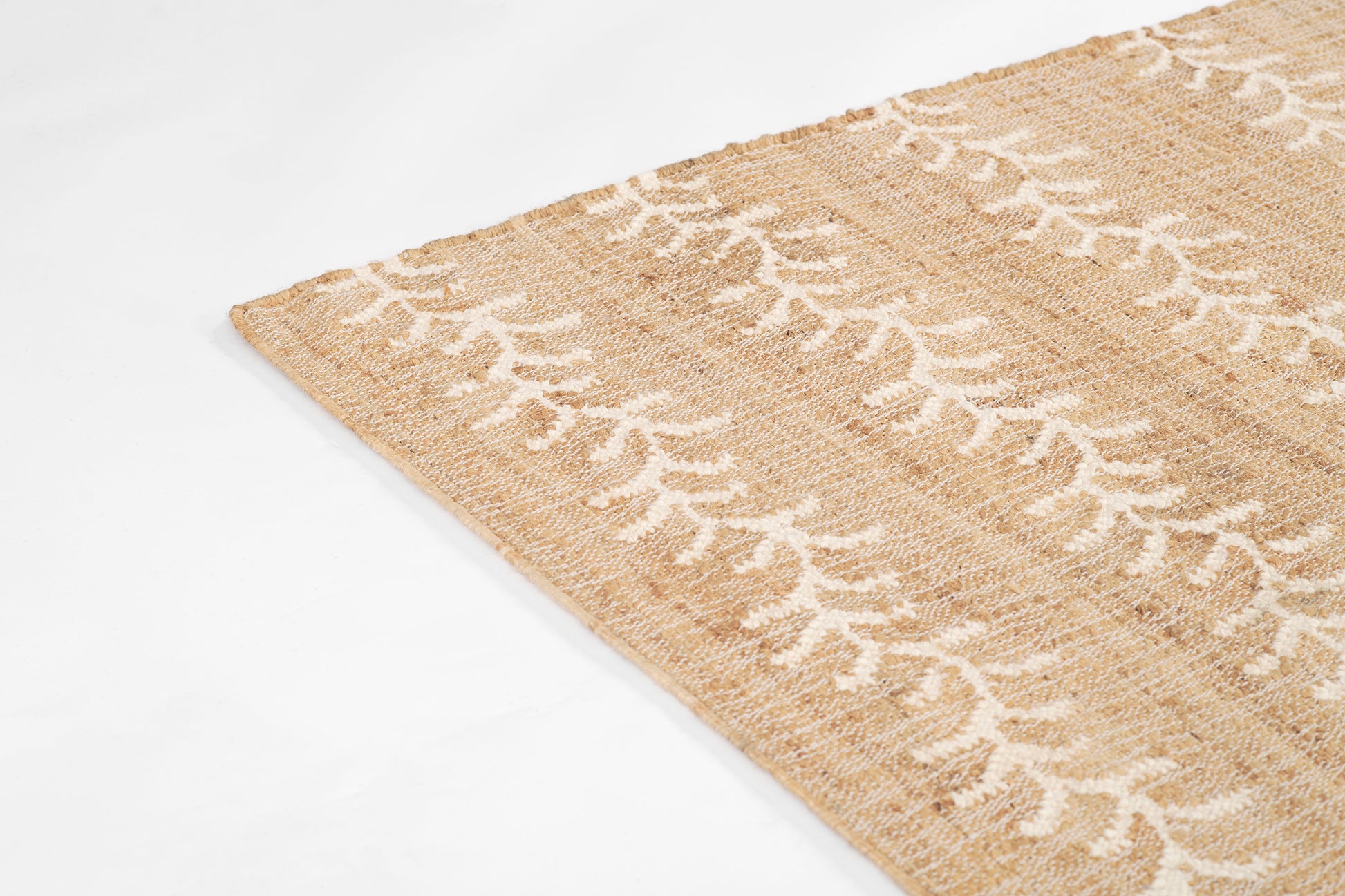 Beige woven jute rug with a white vine stripe pattern; rectangular 8' x 10' rug.