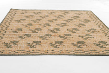 Natural beige woven rug with leaning flower motifs in green and a dark border, rectangular.