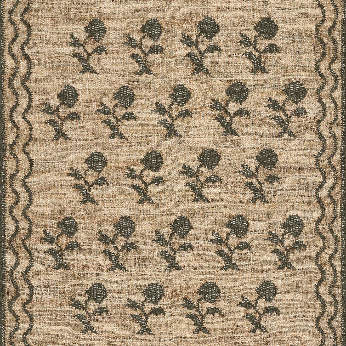 Beige woven rug with repeating dark green botanical motifs in rows and a wavy border on both sides.