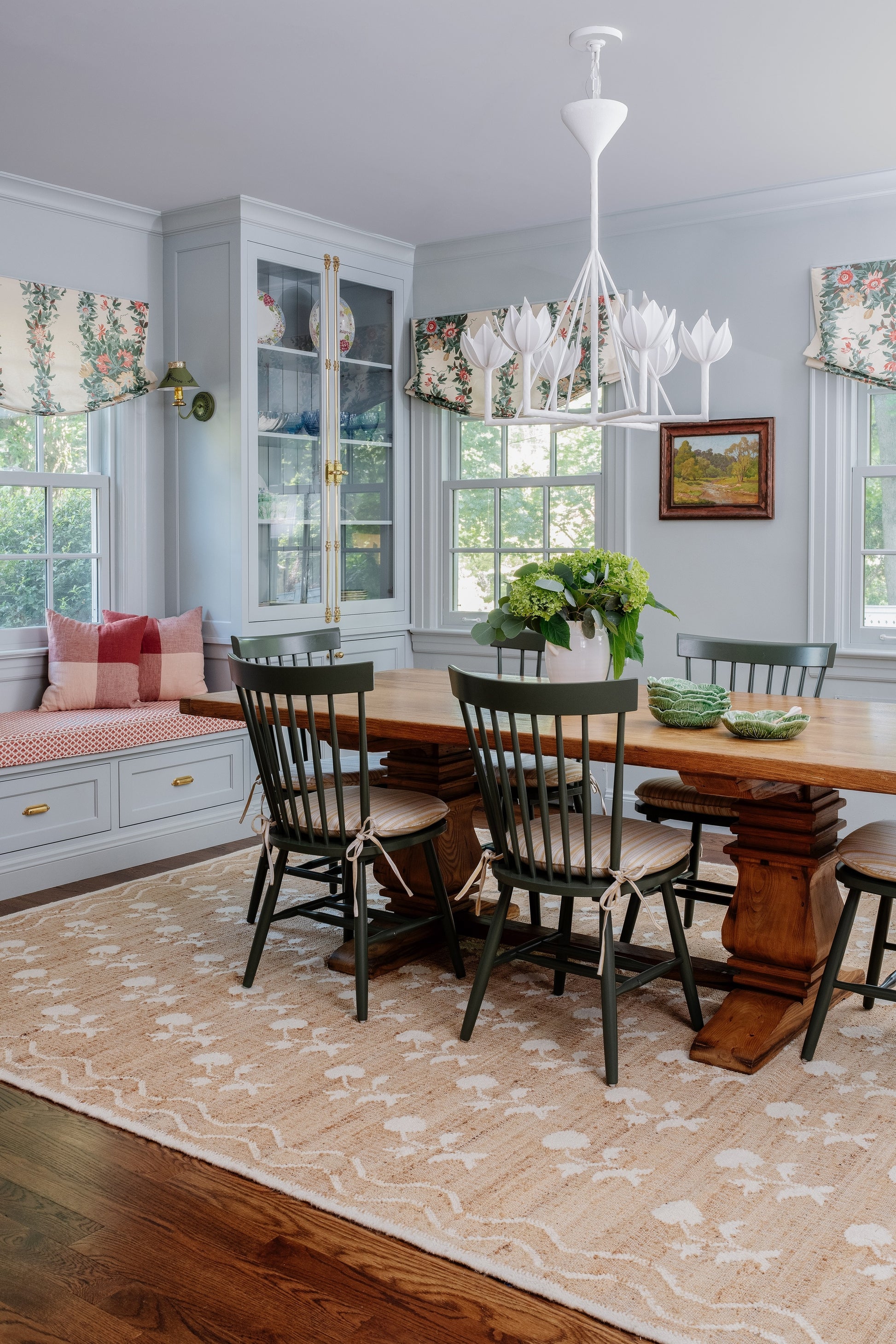 Rug with a floral pattern measuring 3'6" x 5'6", shown under a dining table with wooden chairs.