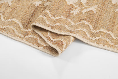 Natural beige jute runner with white wavy chevron pattern; textured, folded edge, rustic boho floor covering.