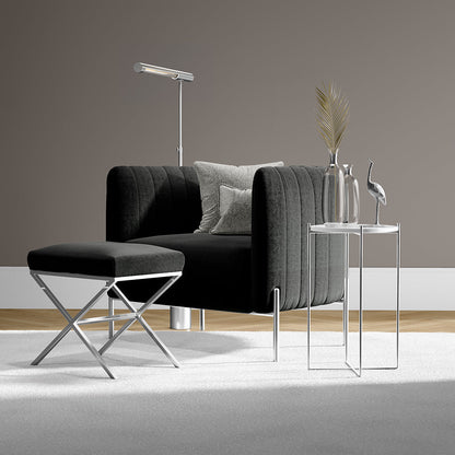 Pine solid fabric seating with a matching ottoman, glass-top tables, and a floor lamp in a neutral living room.