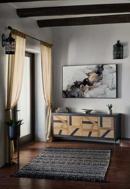 Living room with gray walls, dark wood beams, beige curtains, wood-inlay sideboard, marble art, black lantern sconces, plant, rug.
