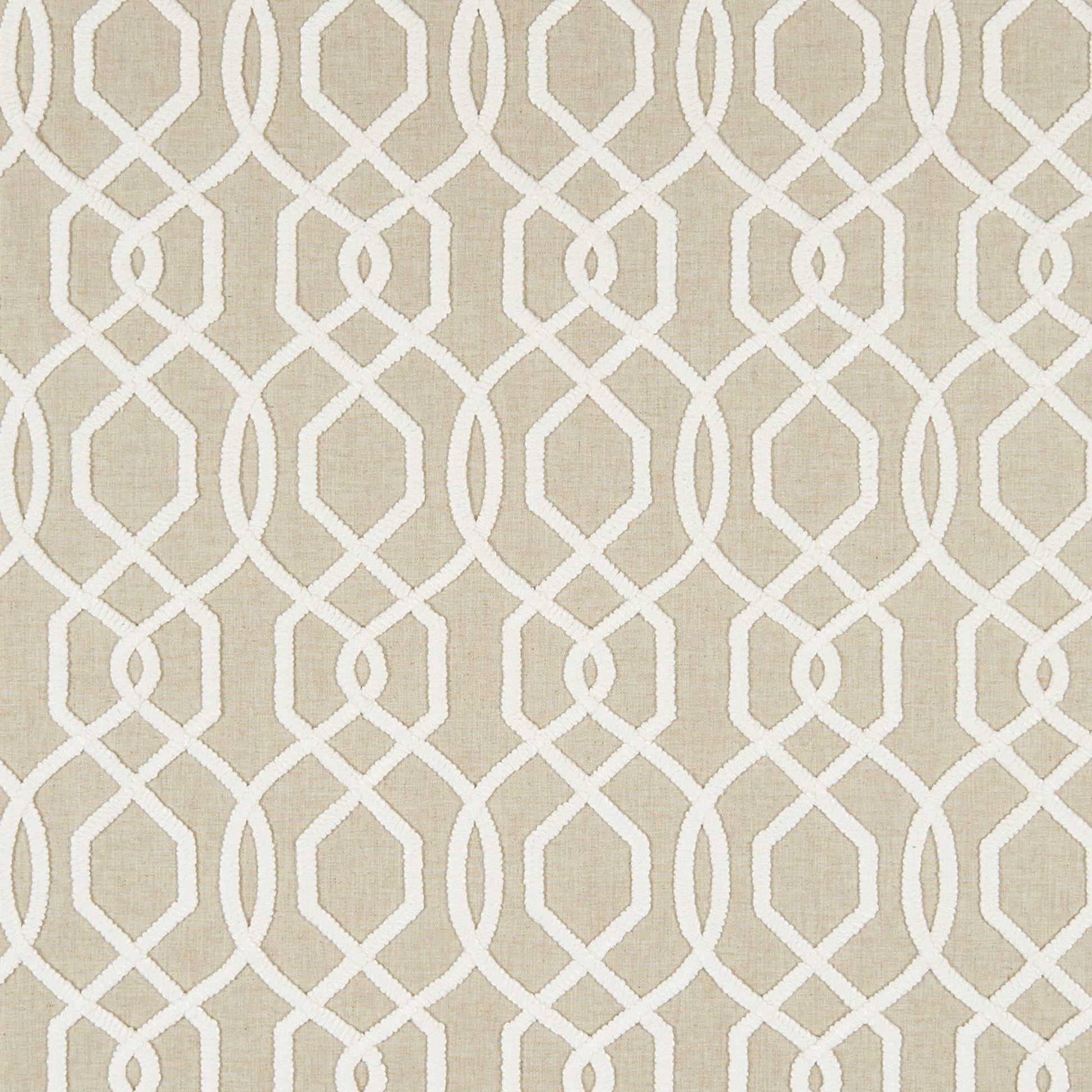 Beige fabric with white interlocking loop lattice pattern; geometric, modern decorative textile.