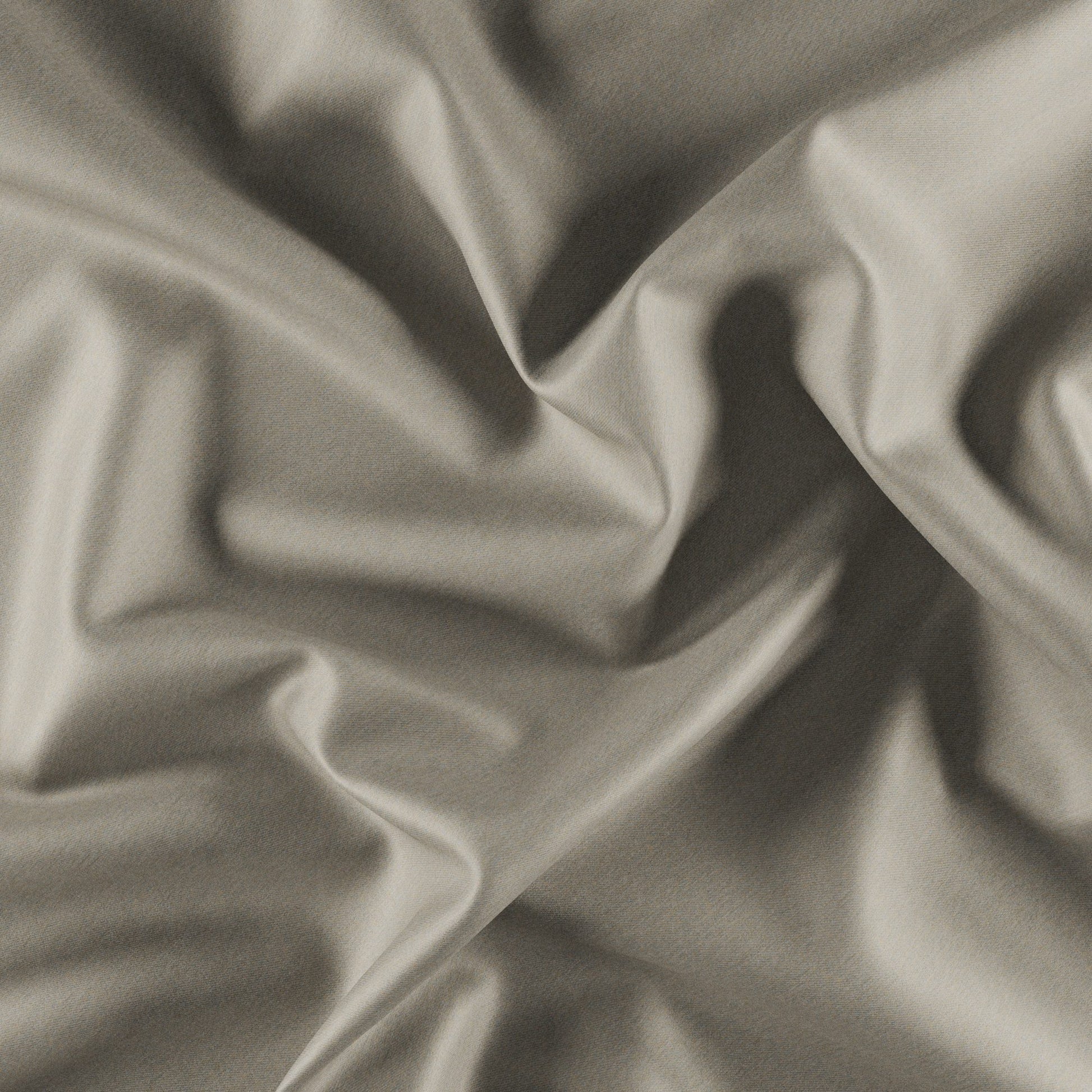 Beige draped fabric with soft folds and subtle shadows.