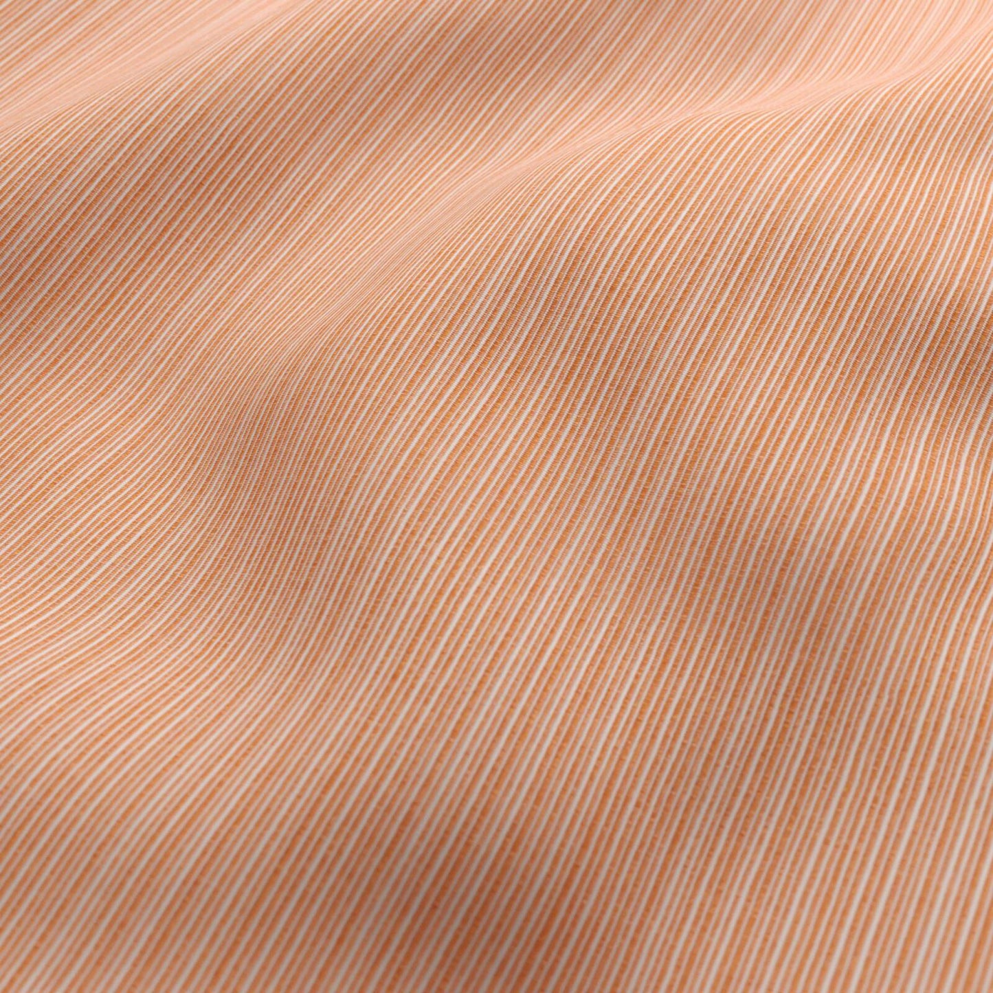 Orange and white striped outdoor fabric with a soft drape.
