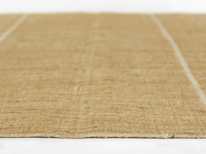 Natural fiber beige area rug with flat-weave jute texture.