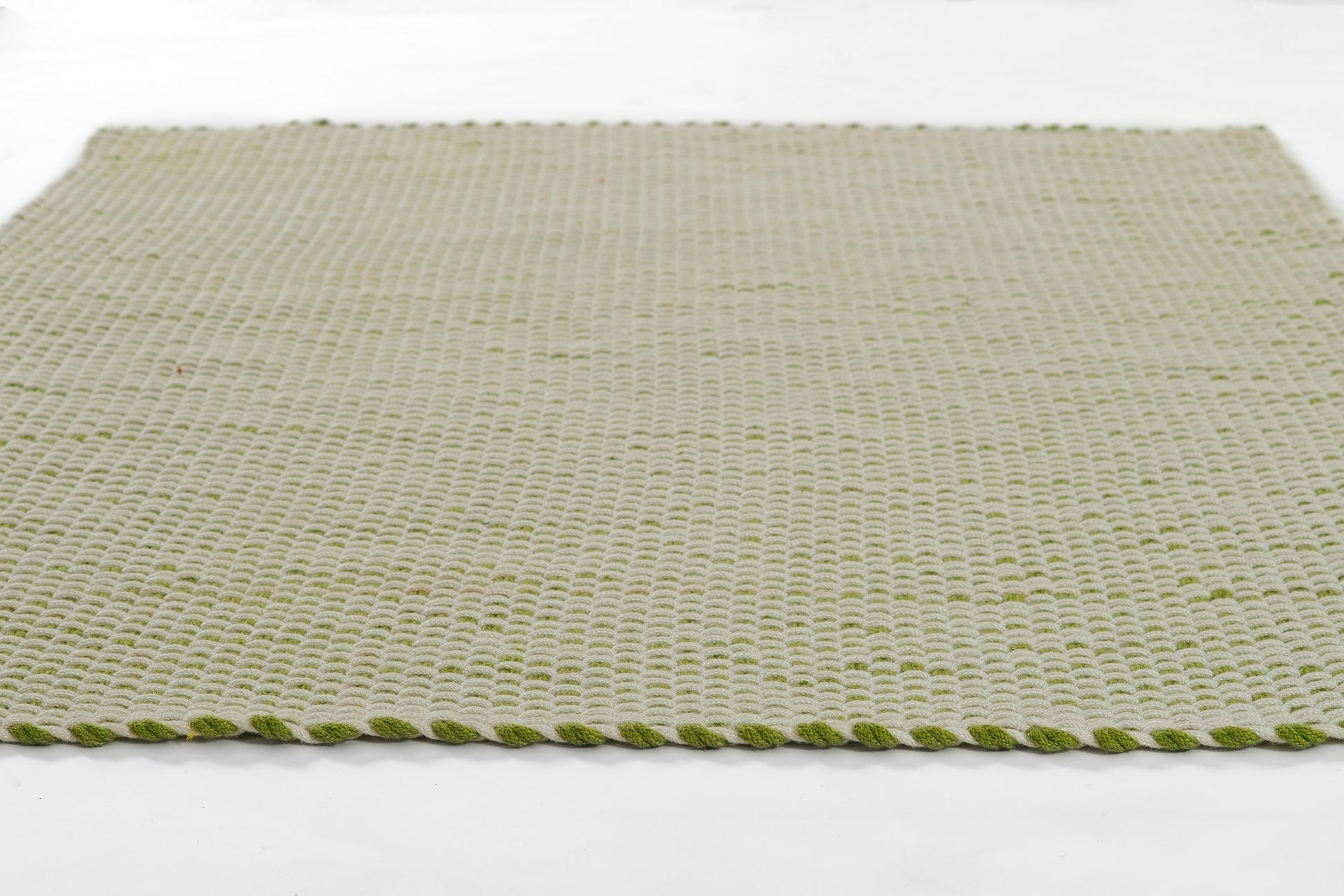 Beige woven runner rug (3' x 8') with a green braided edge.
