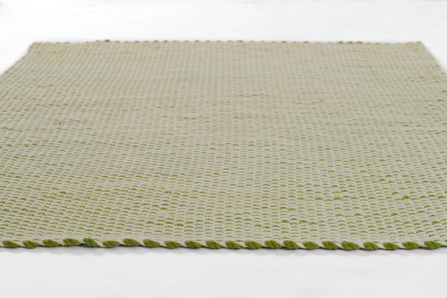 Rectangular beige woven rug in natural fiber with a green braided border, 5' x 8'.