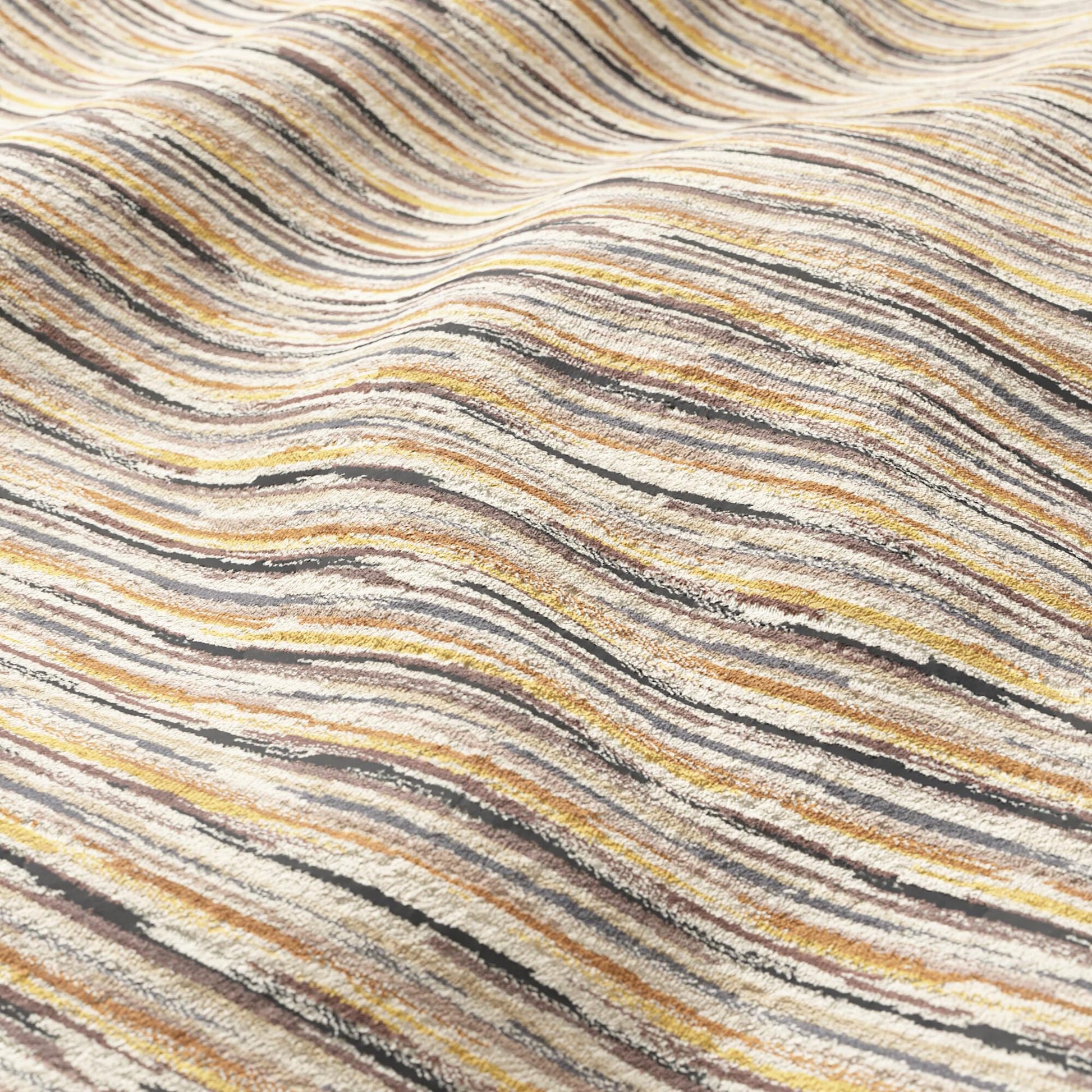 Velvet striped fabric in brown, taupe and grey tones; soft upholstery material.