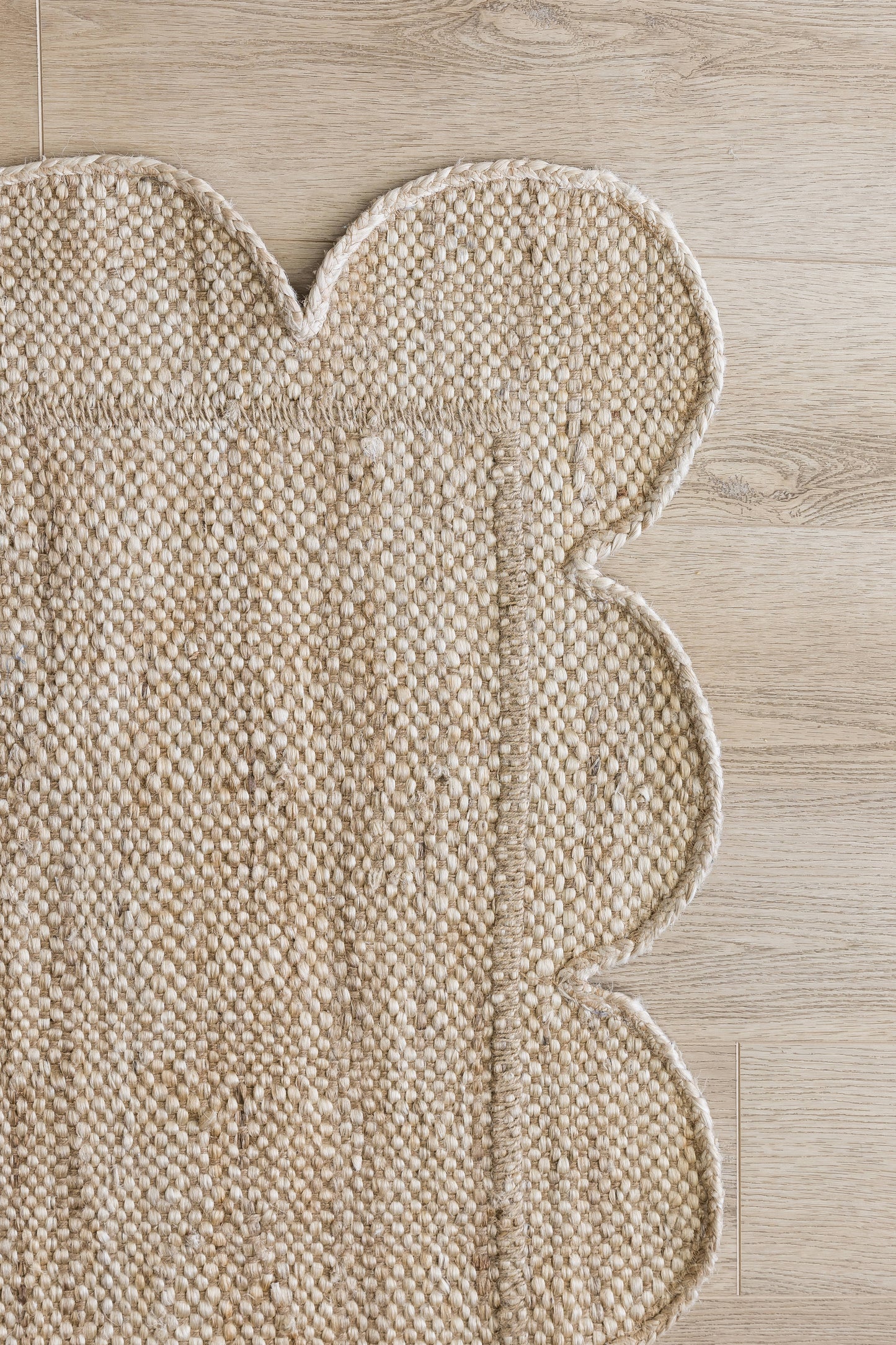 Natural beige woven runner with scalloped border and boucle texture; rustic boho-style runner.
