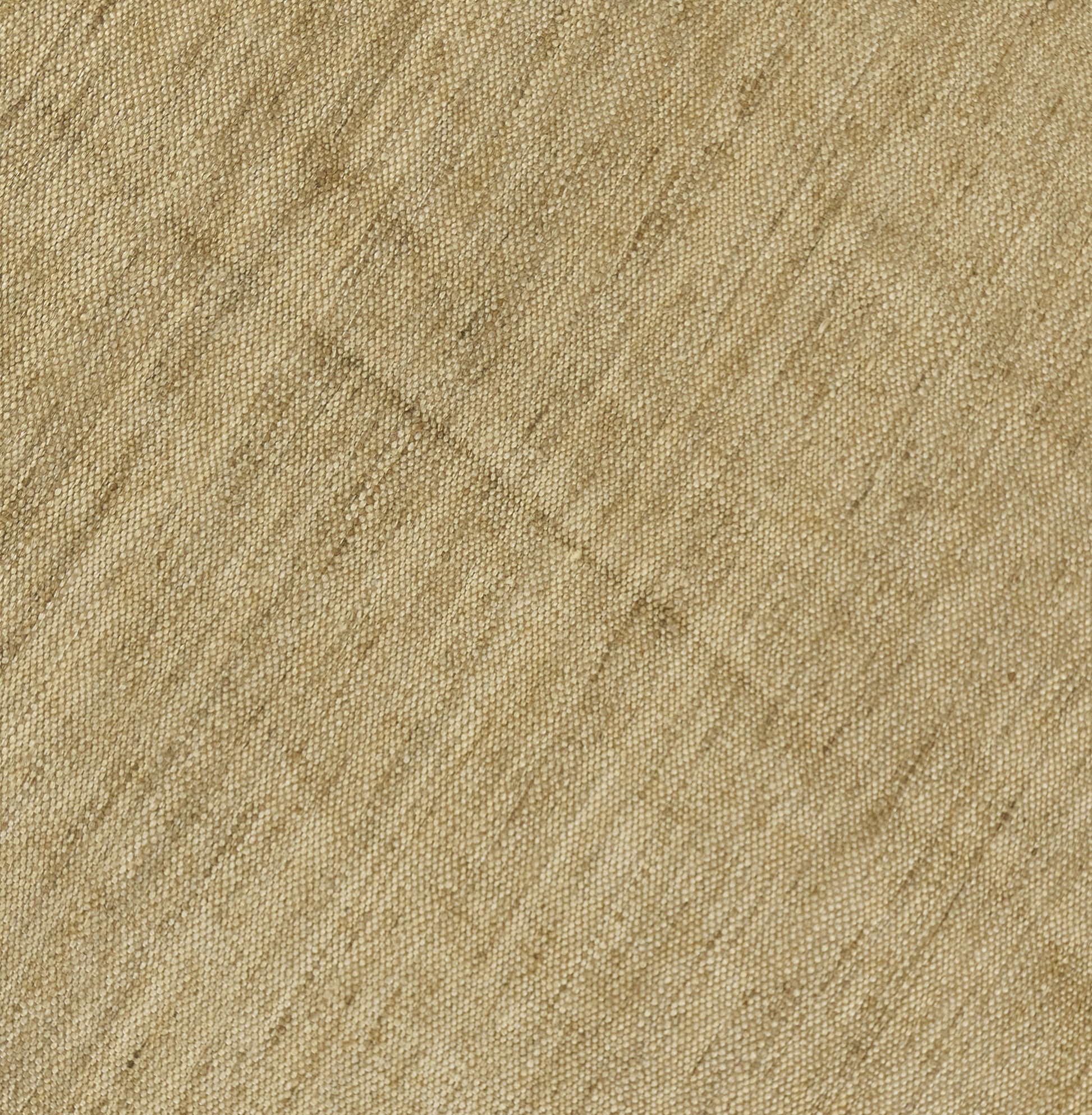Beige natural round rug close-up with diagonal weave and soft textured surface