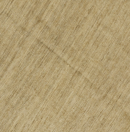 Beige natural round rug close-up with diagonal weave and soft textured surface