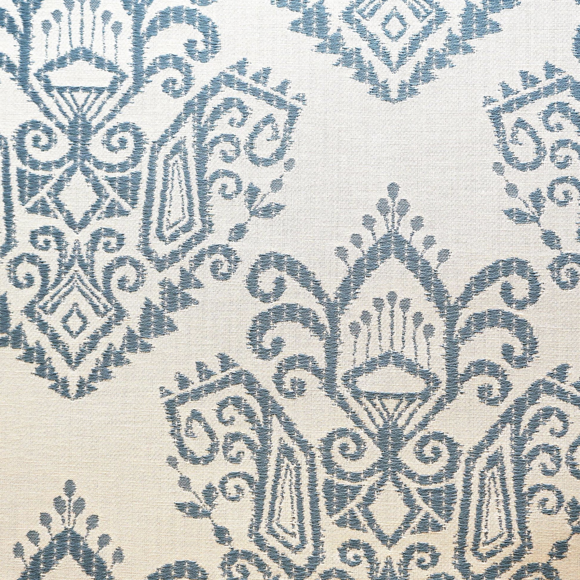 Blue ikat jacquard pattern on cream linen-look fabric; suitable for upholstery, drapes or throws.