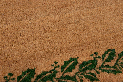 Textured rug with a dark green leafy vine border along the bottom.