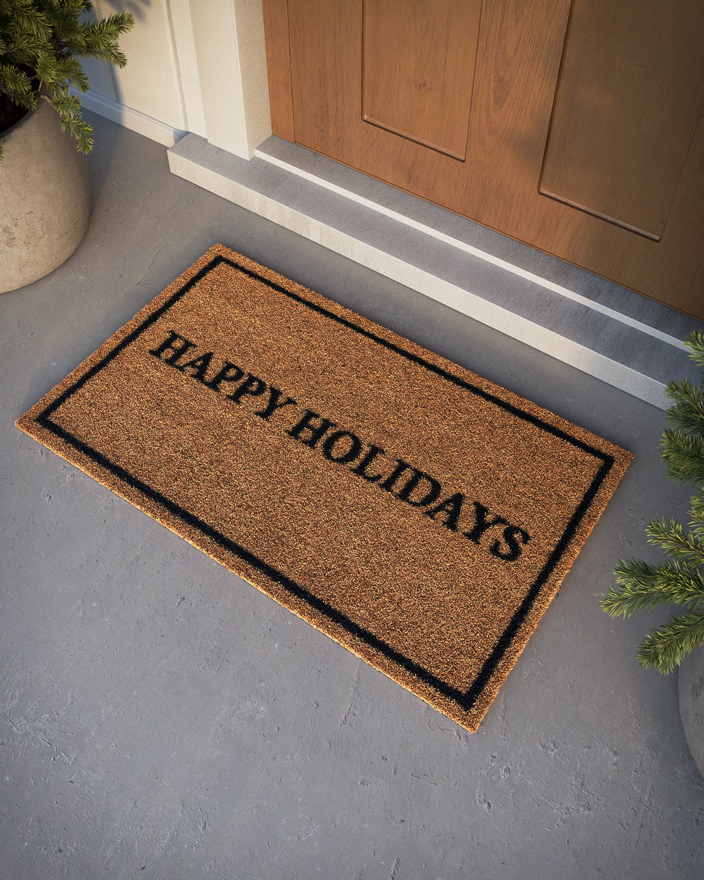 Brown coir rug, 2' x 3', with a black border and HAPPY HOLIDAYS text at a wooden door entrance.