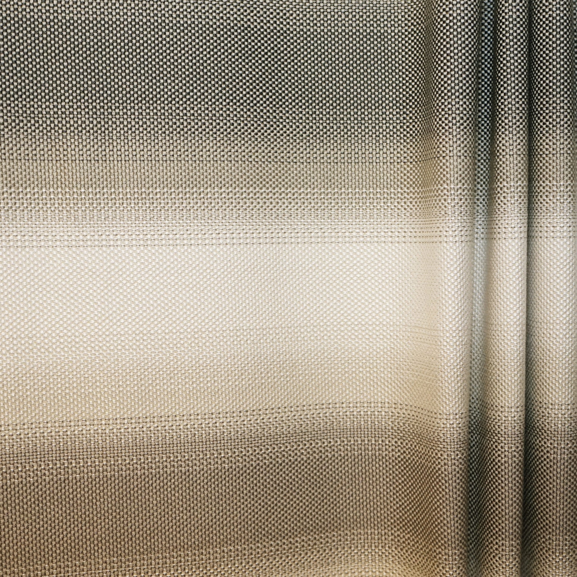 Close-up of fabric showing an ombre beige-to-taupe gradient with a striped jacquard texture.